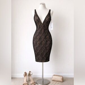 JOVANI BLACK/NUDE DRESS.  Low cut.  Fitted.   Size 0.